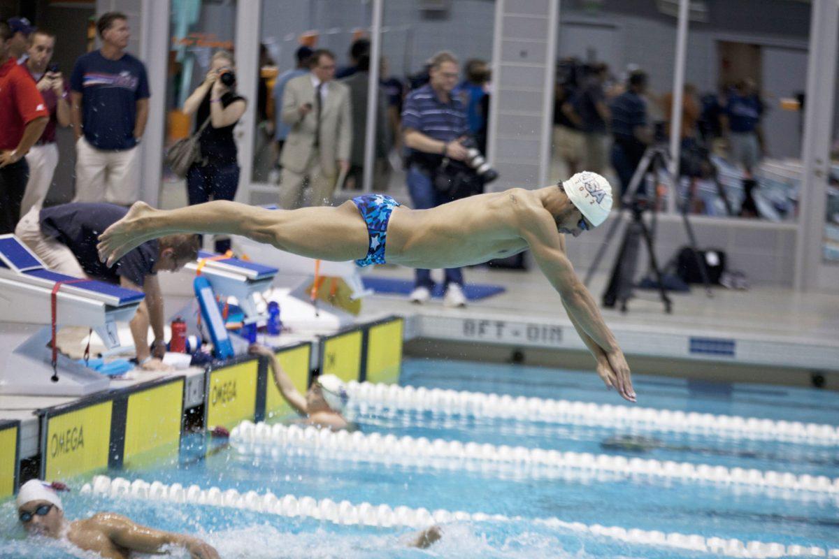 Davis Tarwater dives into the pool during the USA olympics practice on July 12.