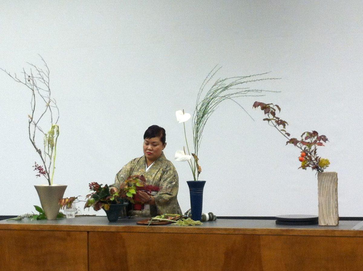 Emiko Suzuki, certified Japanese cultural ambassador, demonstrates ikebana flower arranging during a presentation on Sunday.