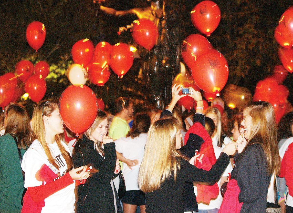 Girls from the Alpha Omicron Pi sorority gather at the "Light the Night" on Friday, Oct. 22, 2011, to walk in memory of Marla Rose Angotti, a member of the sorority who passed away due to leukemia.