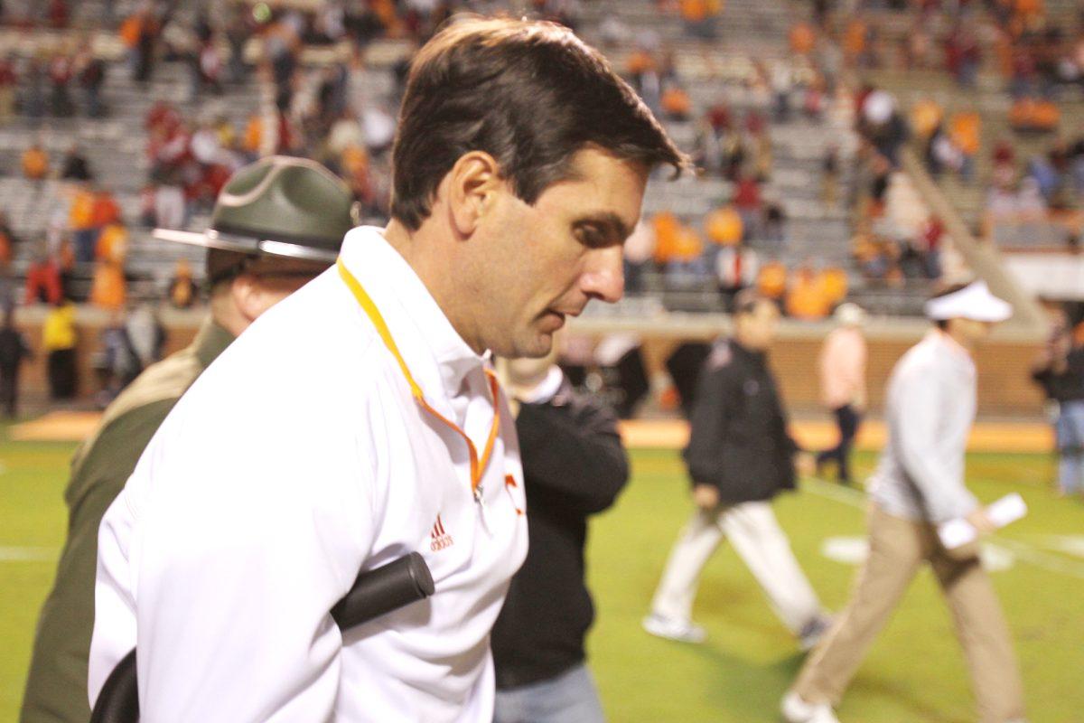 Derek Dooley makes his way off the field in crutches after the 44-13 loss to the Crimson Tide.