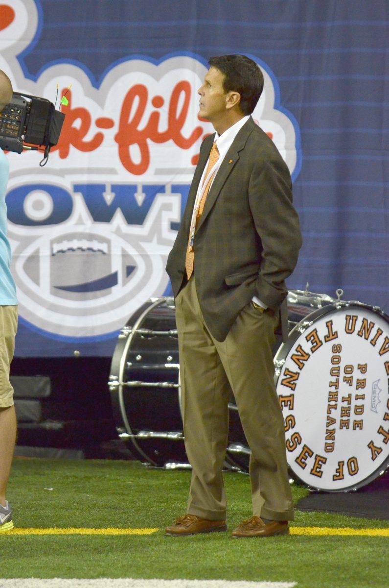 Dave Hart watches a replay in the Georgia Dome against N.C. State on Aug. 31.