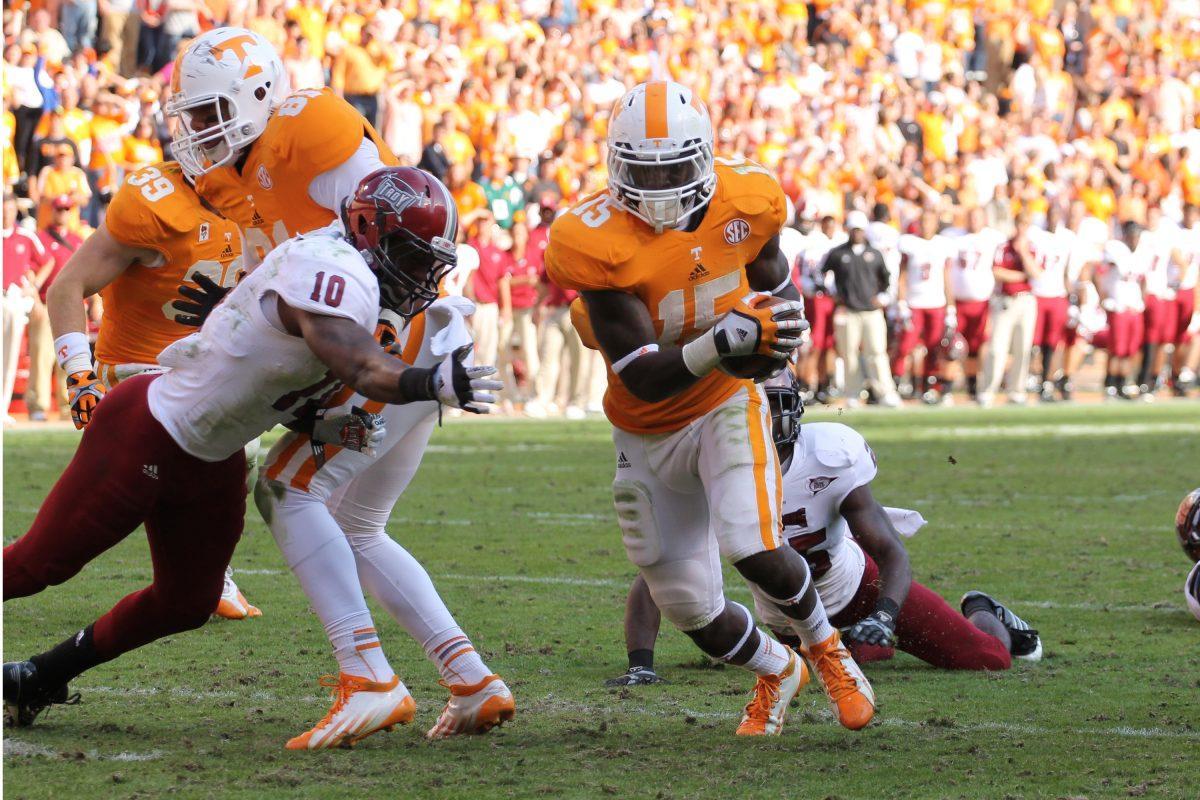 Marlin Lane streaks past a Troy defender on the last touchdown against Troy on Saturday, Nov 3.