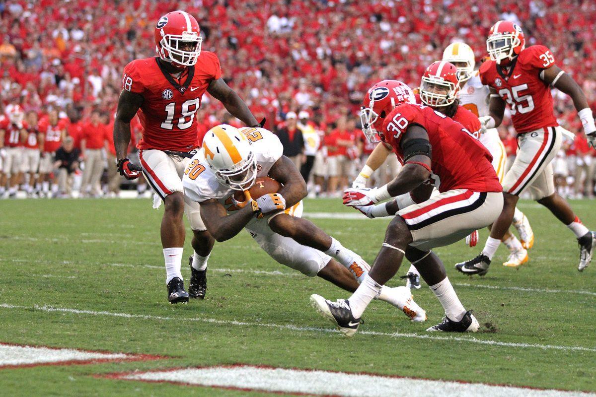 Running back Rajion Neal rushes for a 9-yard touchdown against the Bulldogs in Athens on Sept. 29.