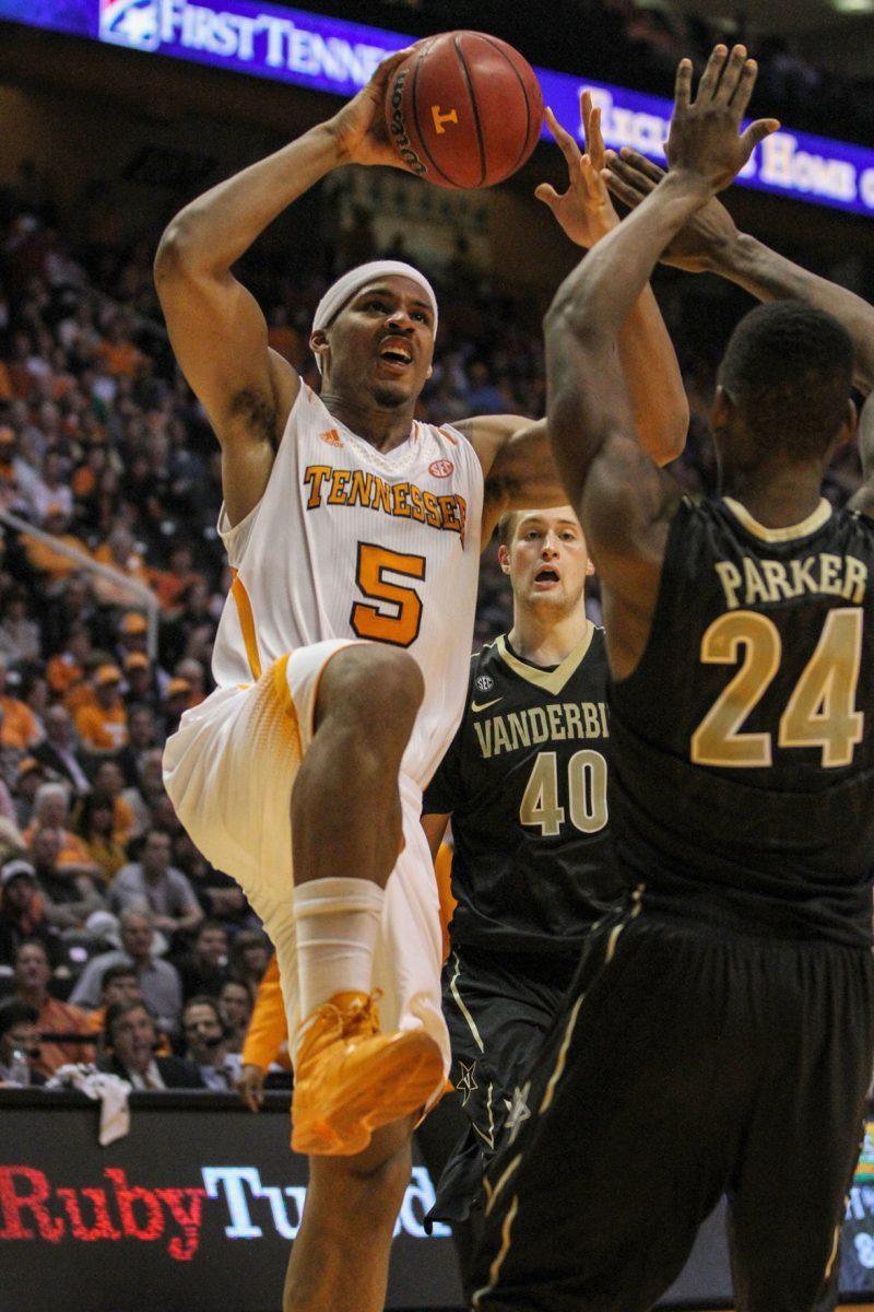 Sophomore forward Jarnell Stokes attempts a dunk over Dai-Jon Parker against Vanderbilt on Tuesday. Stokes scored 19 points with 11 rebounds against Vanderbilt, making it his sixth career high.