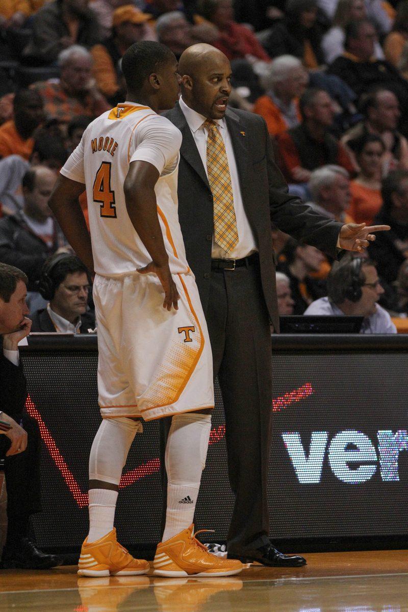 Head coach Cuonzo Martin coaches freshman Armani Moore before substituting against Georgia in Thompson Boling-Arena on Feb. 6.