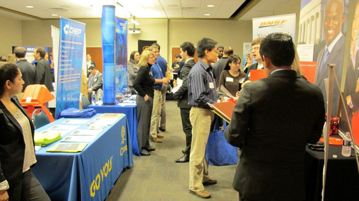 Students talk with companies during the Diversity Job Fair on Monday.
