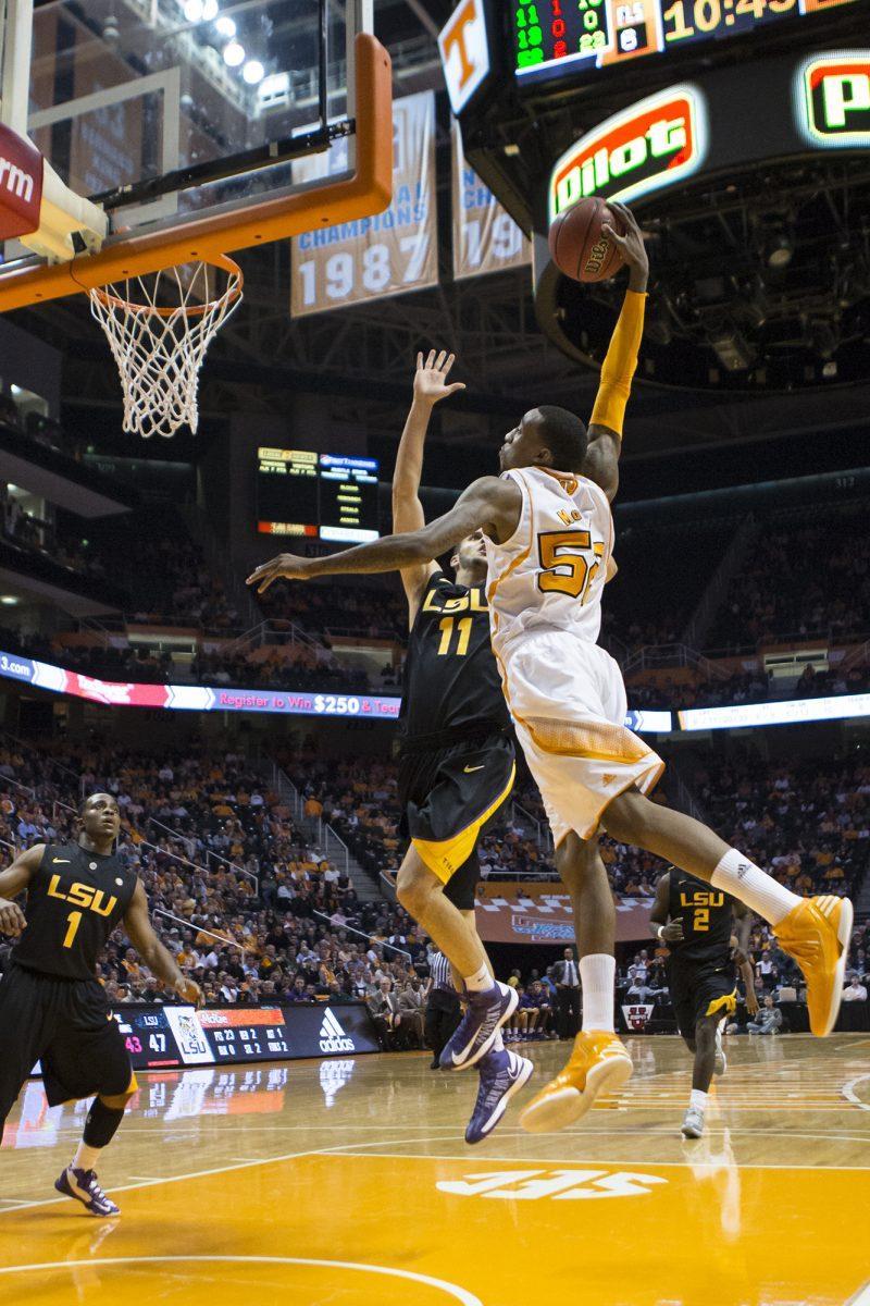 Junior guard Jordan McRae hangs high for a dunk against LSU in Thompson-Boling Arena on Feb. 19.
