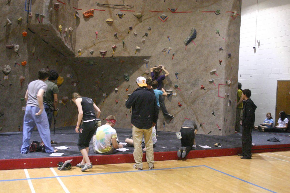 Students compete during a previous climbing competition in HPER at the climbing wall.