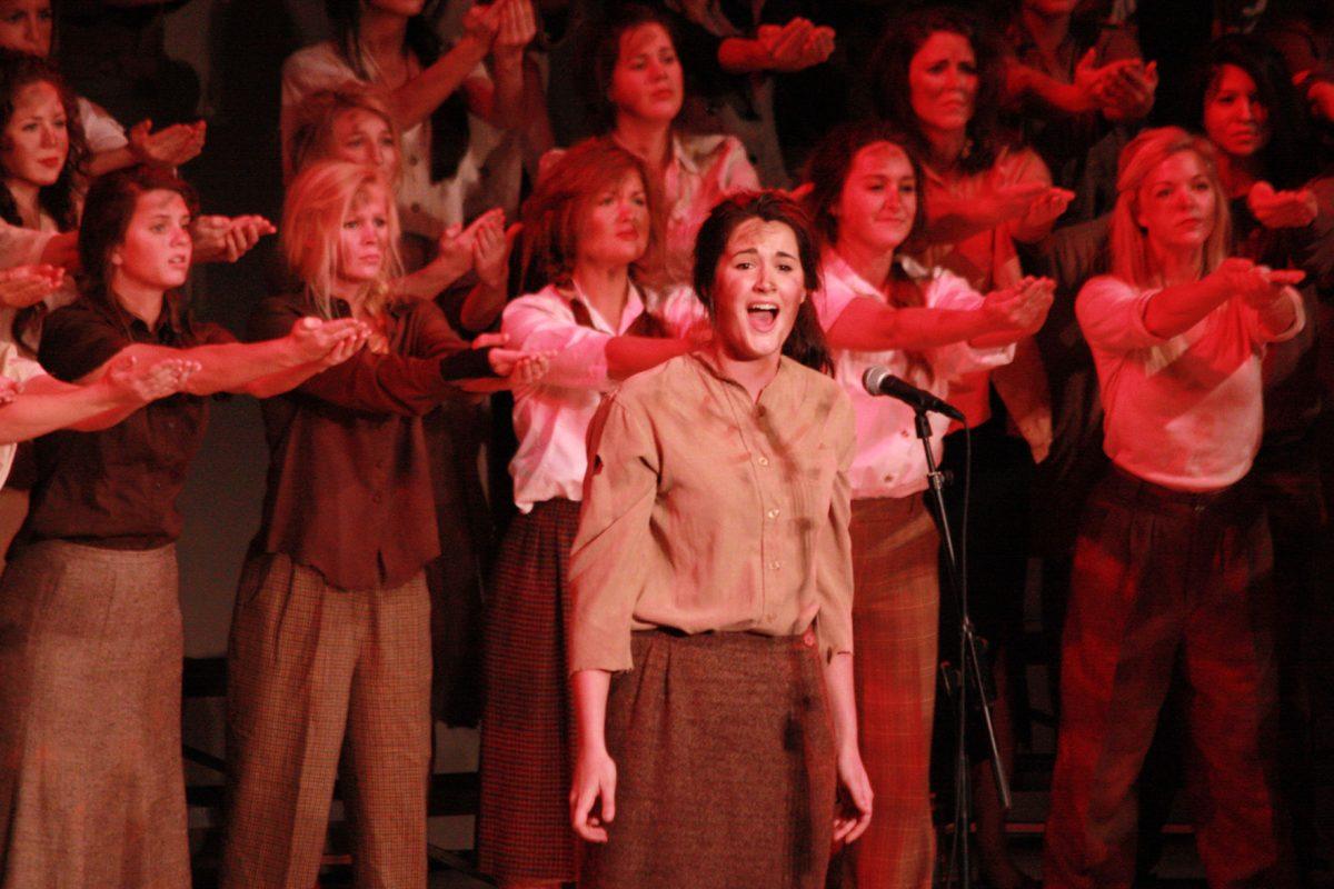 Christina Aicklen, senior in Journlism and Electronic Media, of Alpha Chi Omega sings during the "All-Sing" event in Cox Auditorium on Feb. 7. The first "All-Sing" event was held in 1932.