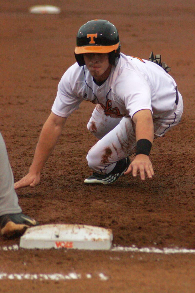 A Tennessee baseball player makes a slide for the base against Alabama on April 1, 2012.