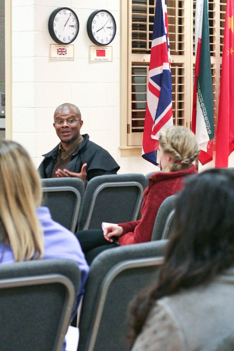 Dr. Robert Washington-Allen, a UT geography professor, tells students about his experiences as a Peace Corps volunteer during the Peace Corps Global Hour in the International House on Feb. 27.