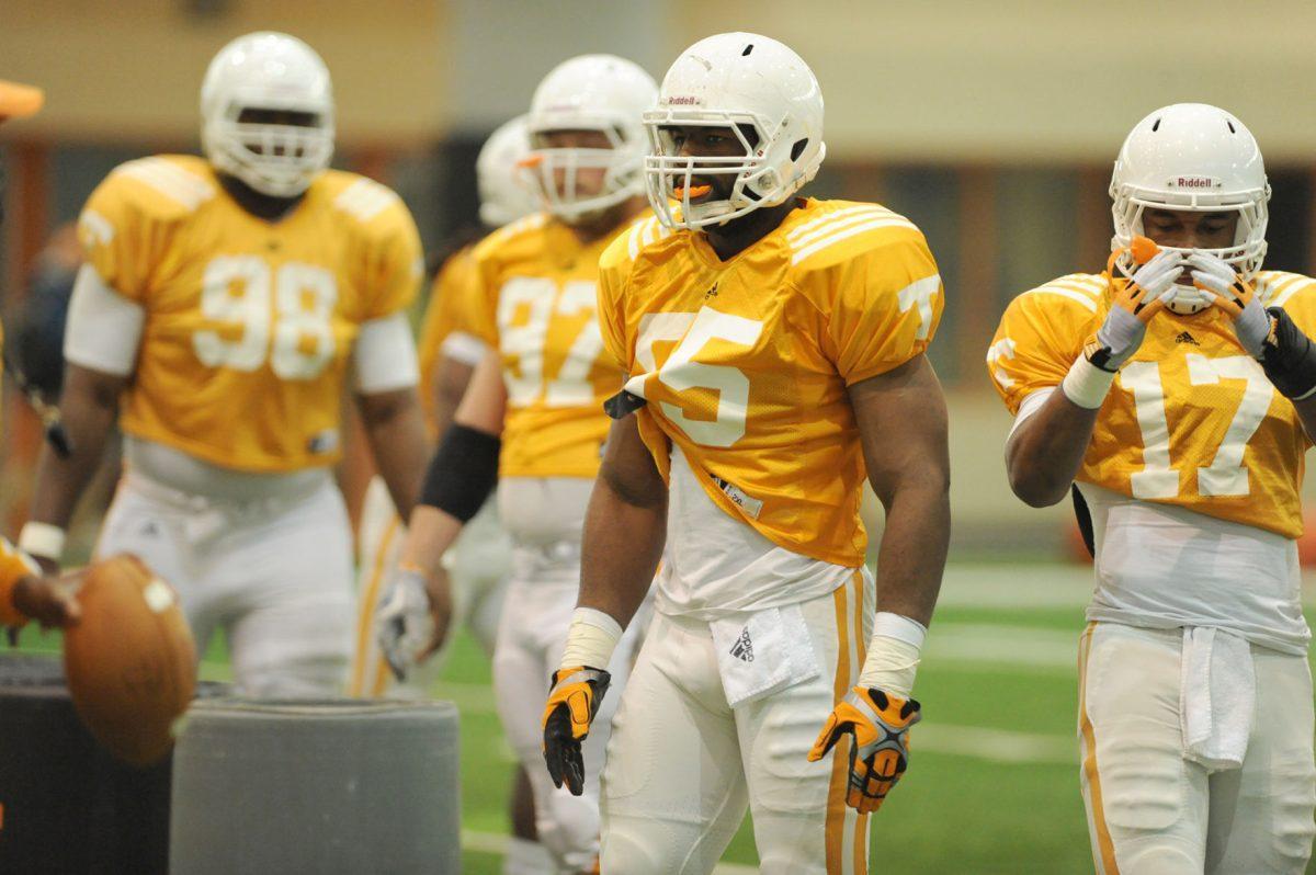 Linebacker Jacques Smith listens to instructions for a drill during spring practice on March 14.