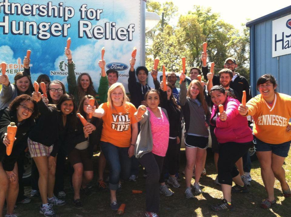 The Tallahassee ASB group celebrating after sorting seven tons of carrots at America's Second Harvest of the Big Bend.