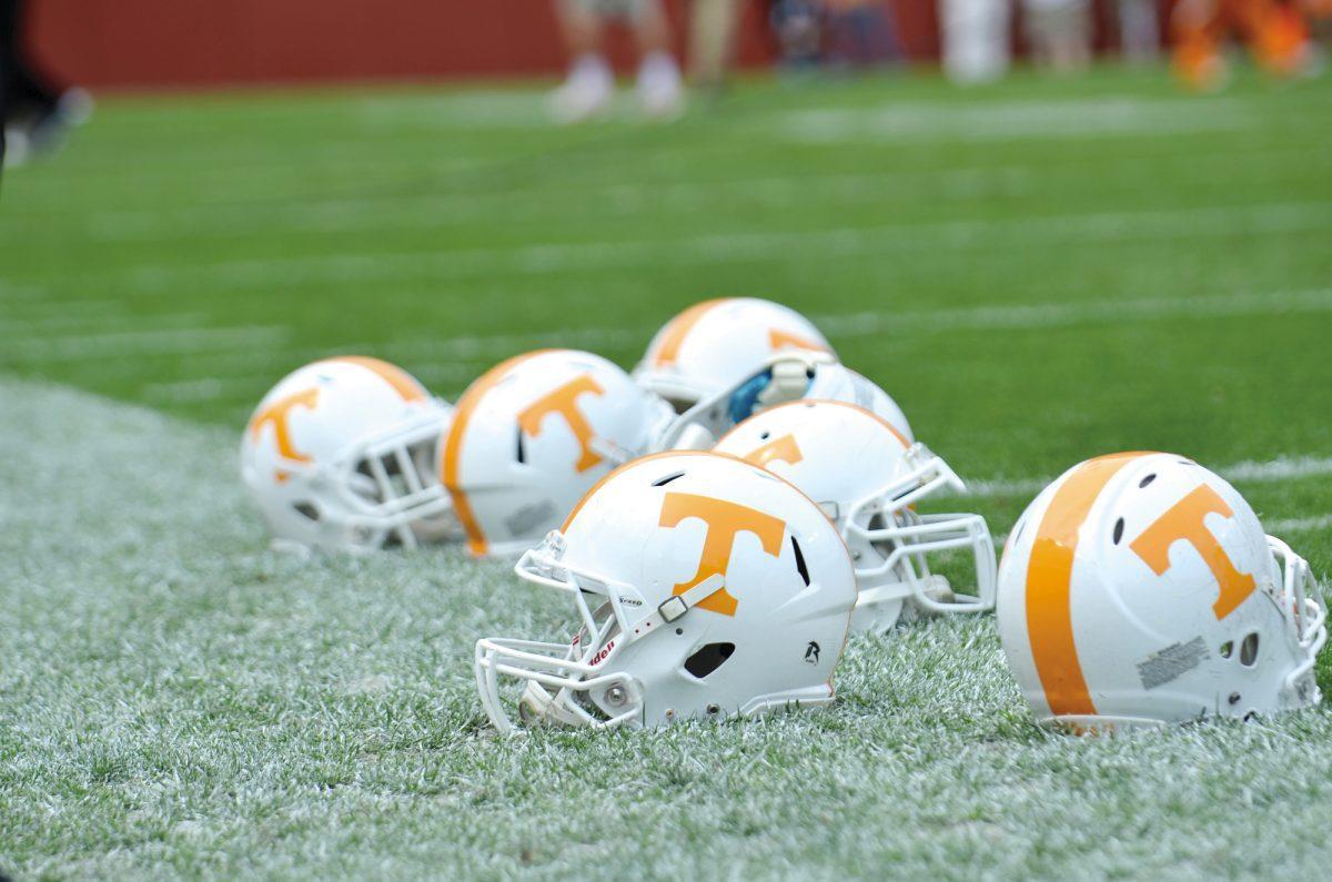 Helmets lay on the sideline before last year's Orange and White game.