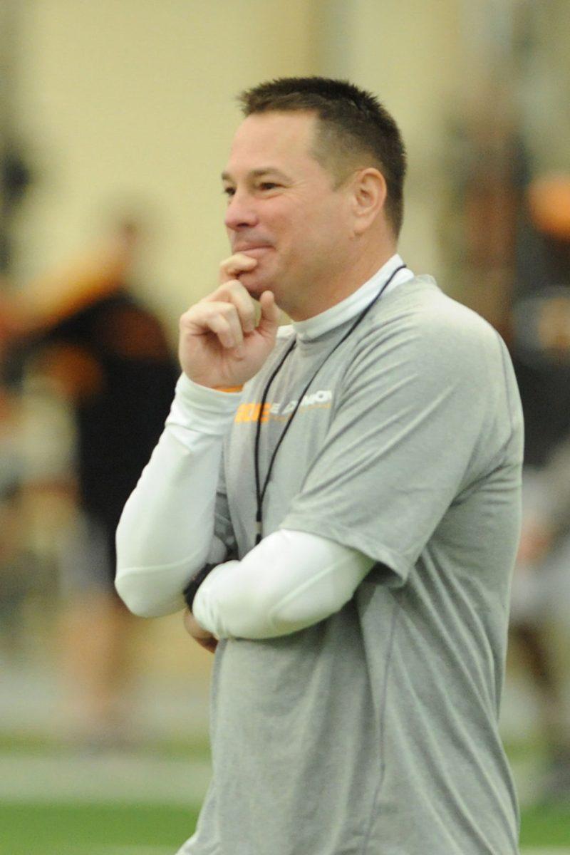Head coach Butch Jones watches his team run drills during spring practice at the indoor practice facility on March 14.