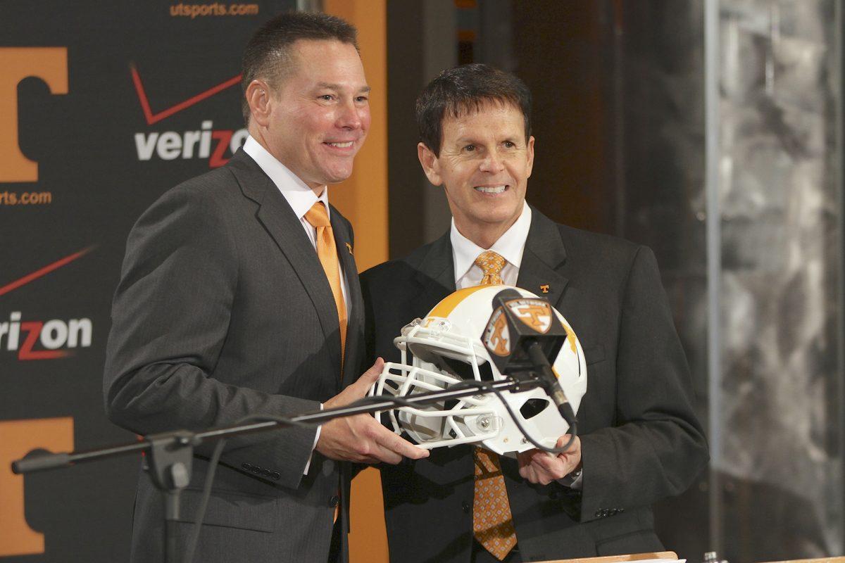 Dave Hart poses with new football head coach Butch Jones on Dec. 7, 2013.