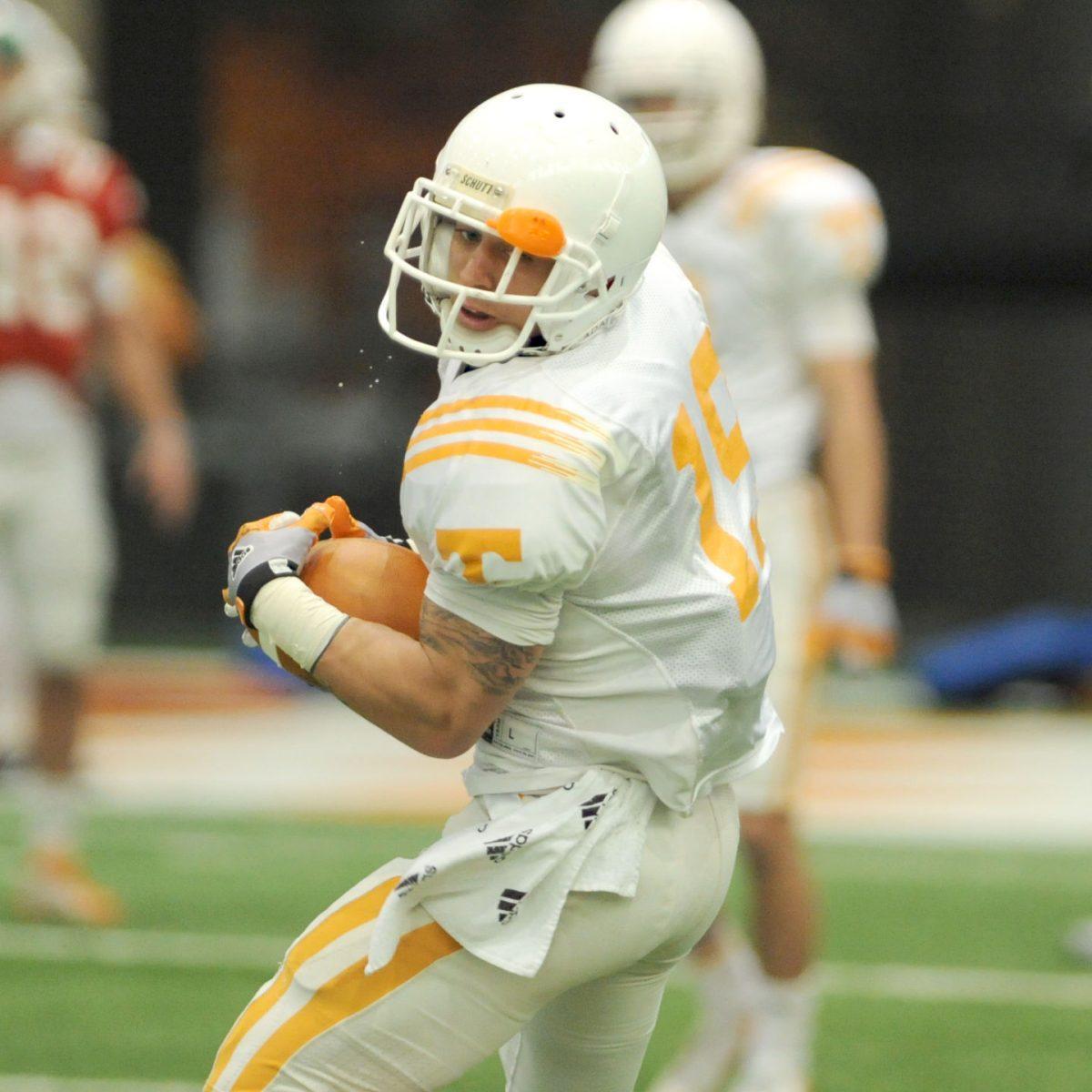 Junior wide receiver Devrin Young participates in a drill during spring practice in the indoor facility on March 14.