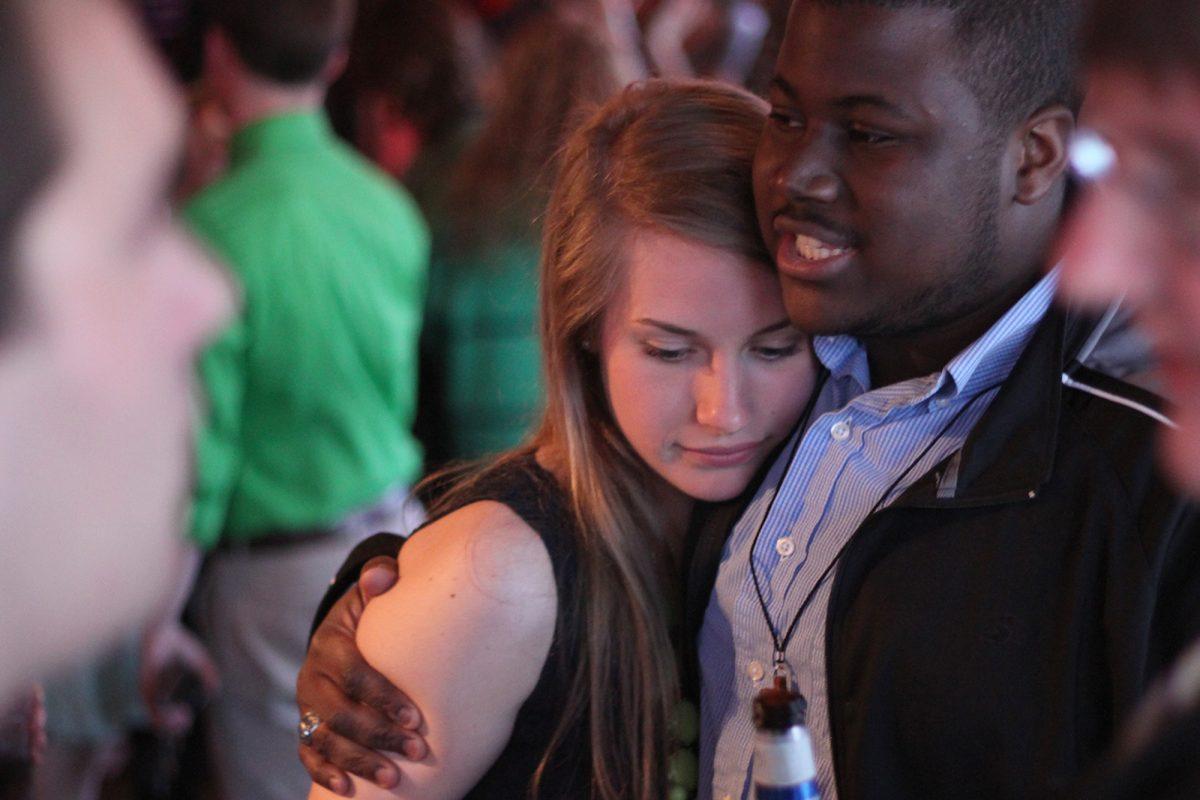 Laura Burgin, Vice president of Engage, hugs a supporter after announcing to their party the SGA winner would be announced on April 5.