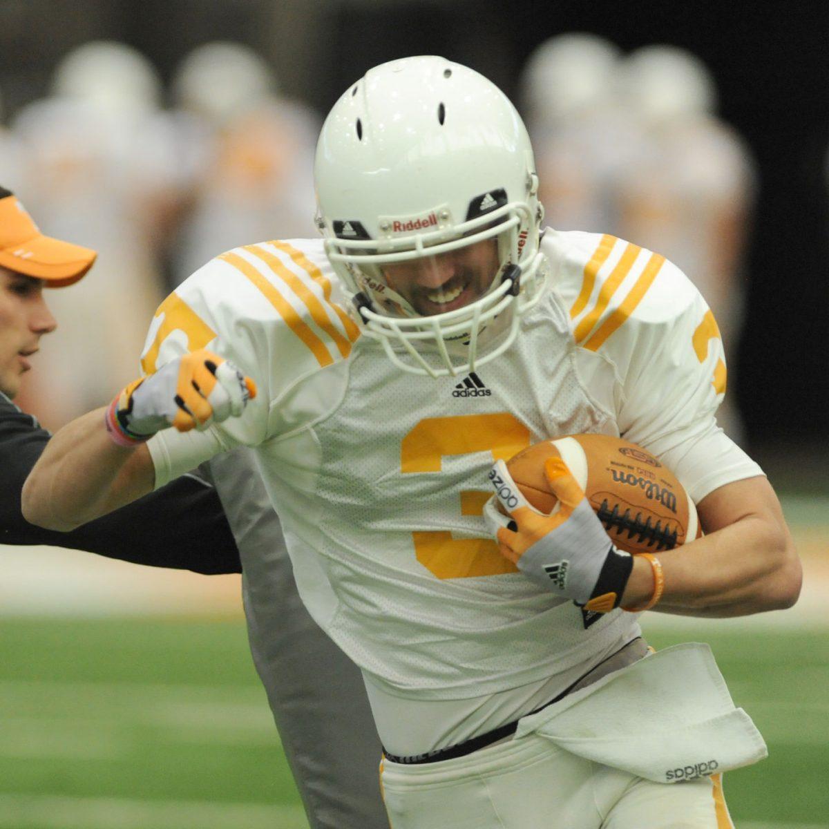 Redshirt senior Tyler Drummer practices offensive running drills during spring football practice on March 14.