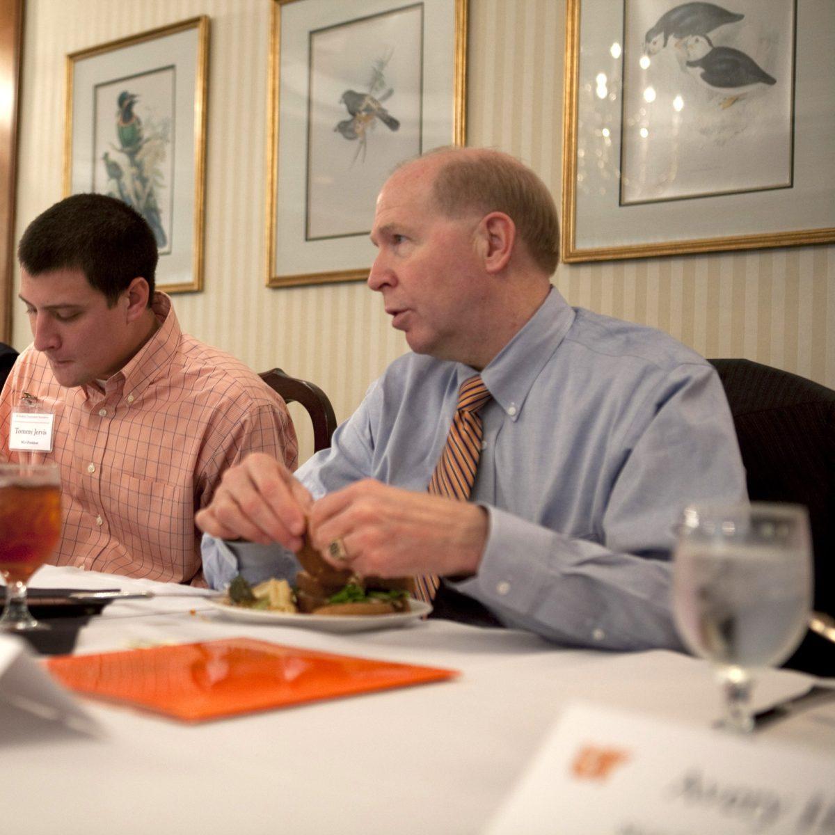 Vice Chancellor of Student Life Timothy Rogers enjoys a formal meal as part of a luncheon in 2010.