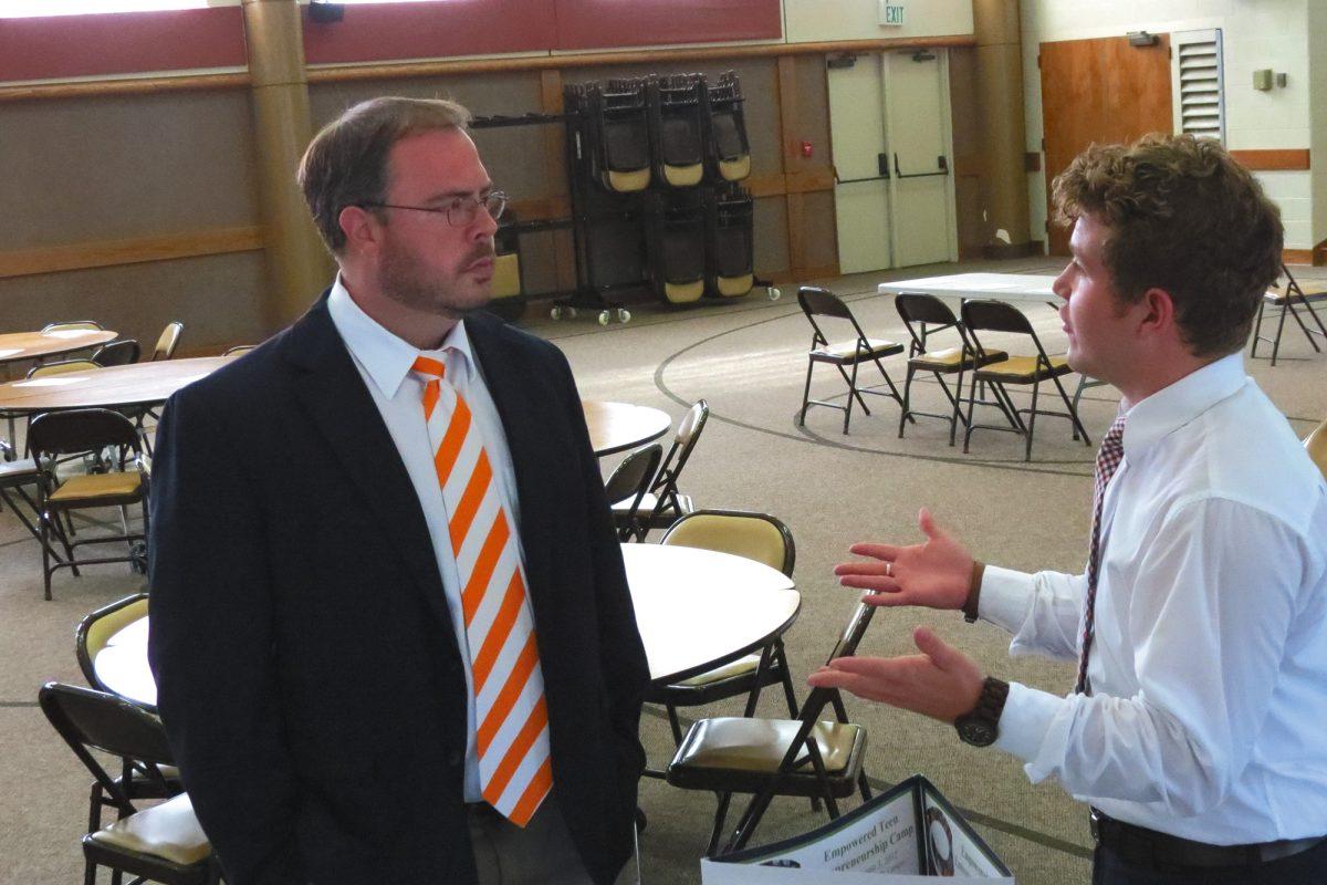 Parker Jenkins discusses entrepreneurial project with UT professor Joshua Ray.