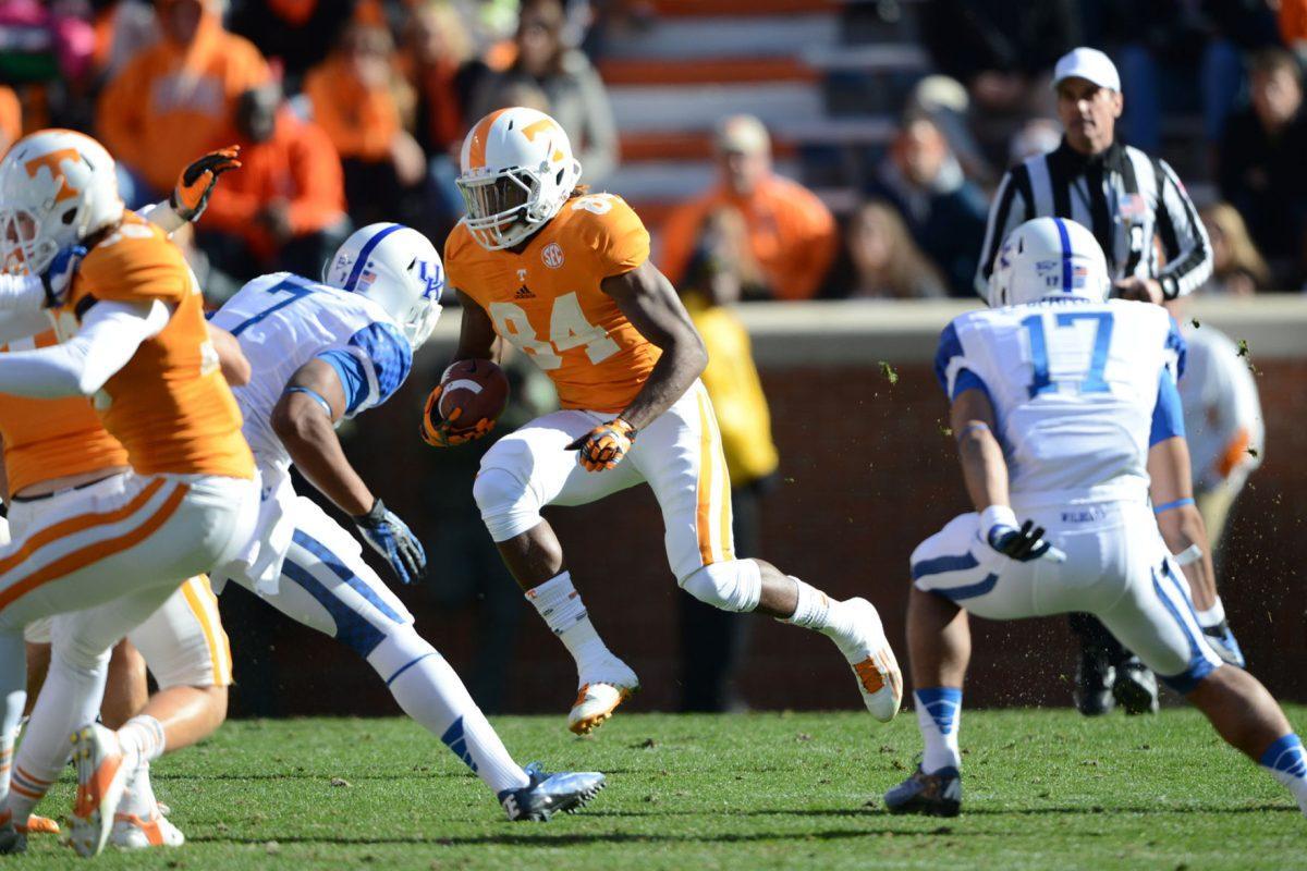 Wide receiver Cordarrelle Patterson, No. 84, jukes past defenders during a game between Tennessee and the Kentucky Wildcats at Neyland Stadium on Nov. 24, 2012.