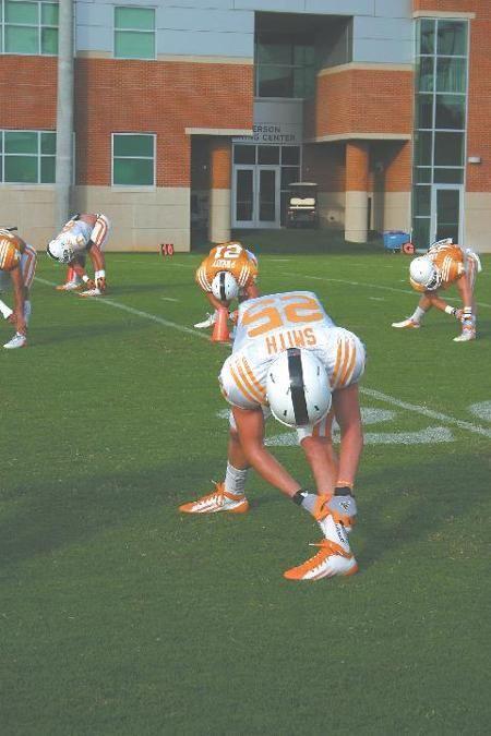 Freshman wide receiver Josh Smith stretches before practice at Haslam Field on Aug. 19. Smith is one of several Vols still working to have their stripe removed.