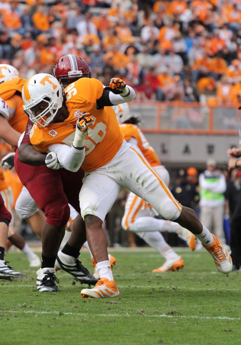 Junior linebacker Curt Maggitt rushes the quarterback against Troy in UT's 5548 win on Nov. 3, 2012. Maggitt has been rehabbing a torn ACL during the offseason.