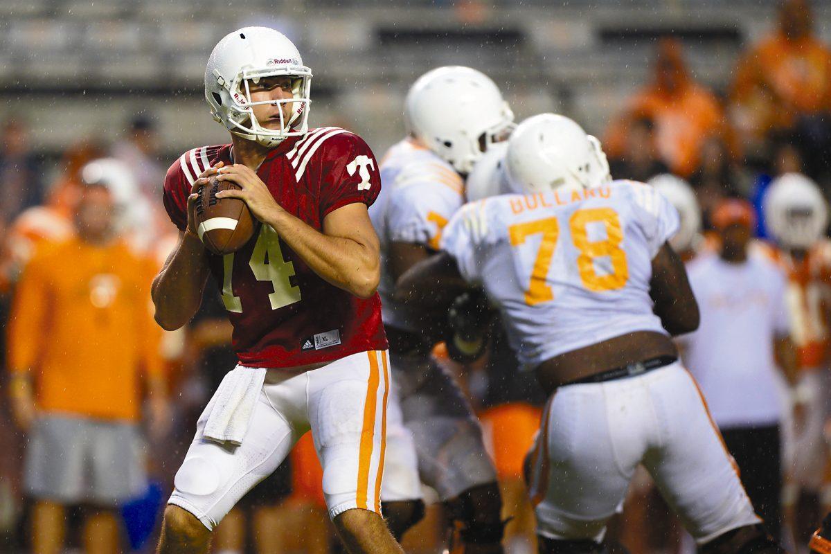 Quarterback Justin Worley looks for a receiver in the rain during Tennessee's open practice at Neyland Stadium on Aug. 17. Worley was named UT's starting quarterback on Aug. 26 for the team's season opening game against Austin Peay.