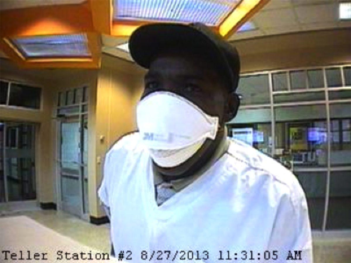 Photograph taken while suspect attempted to rob UT Federal Credit Union.