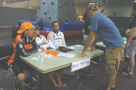Tyler Bullich, freshman in mechanical engineering, gathers information from the Bass Fishing Club at this year's RecFest event in TRECS on Aug. 20. Bullich, a New York native, is one of many students who gained insight into recreation-based club involvement.