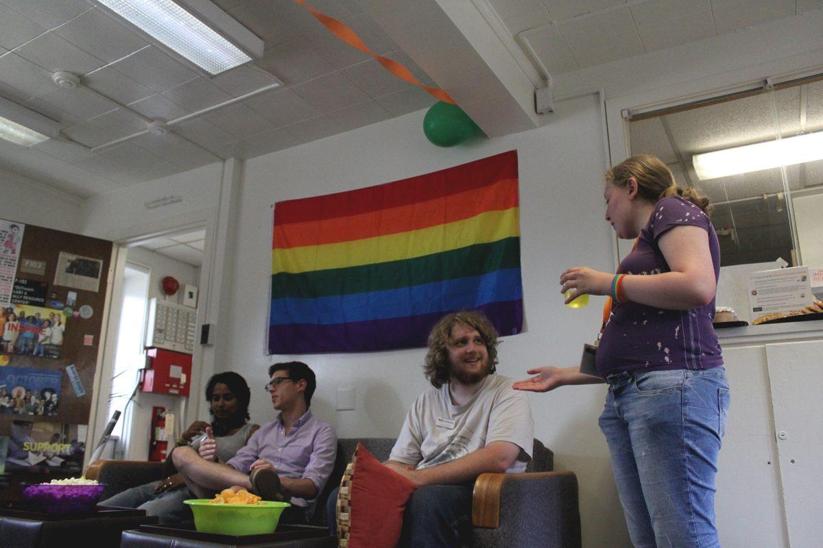 Students mingle at the Rainbow Open House in the OUTReach: LGBT &amp; Ally Resource Center on Aug. 22.