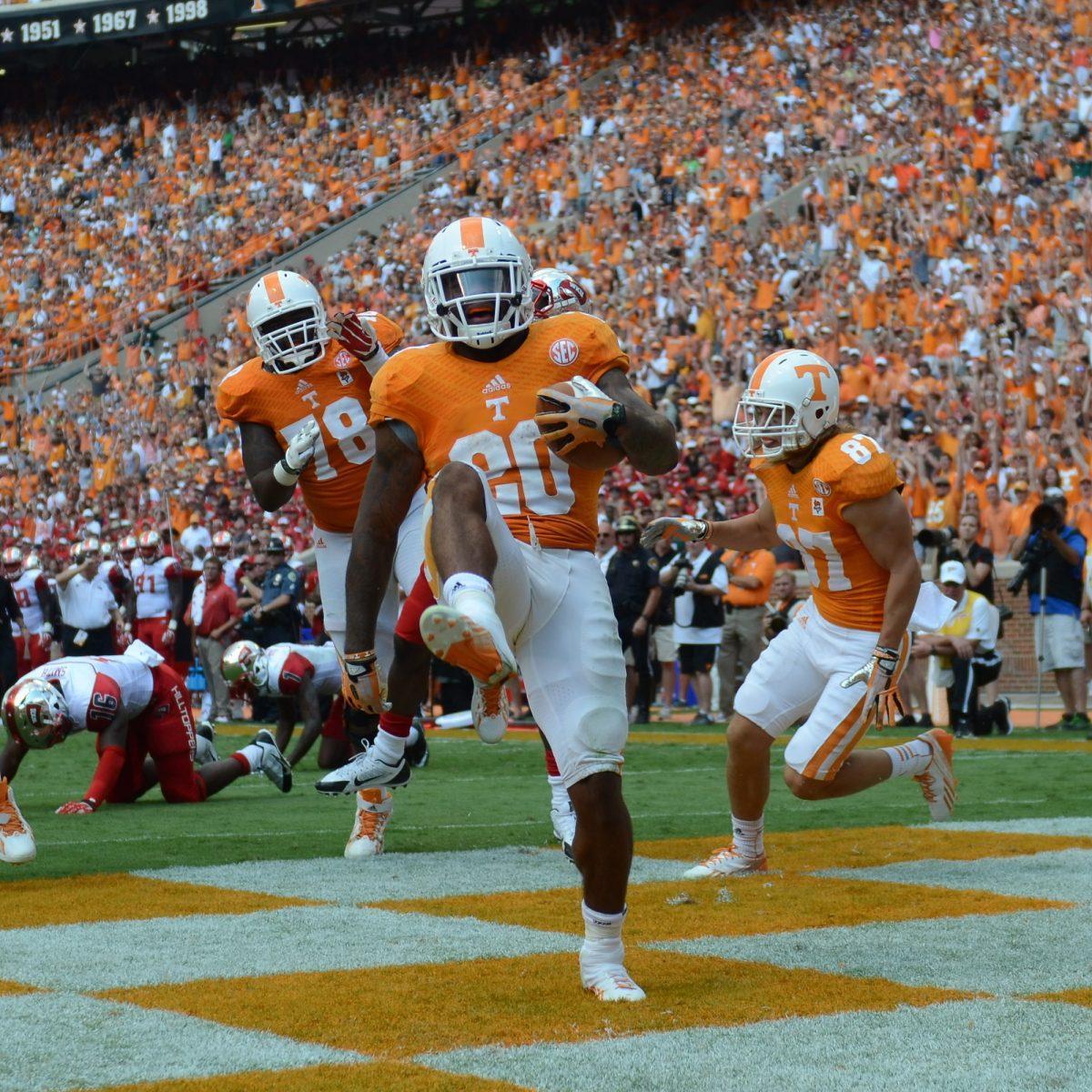 Senior running back Rajion Neal celebrates one of three touchdowns against Western Kentucky on Sept. 7 in Neyland Stadium. With a potential change at quarterback this week at "The Swamp," Neal could be asked to shoulder the load offensively for the Vols.