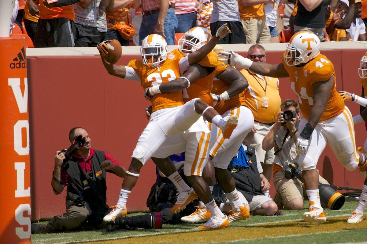 Cornerback Cameron Sutton celebrates with his teammates after returning an interception for a touchdown against Western Kentucky at Neyland Stadium on Saturday, Sept. 7.