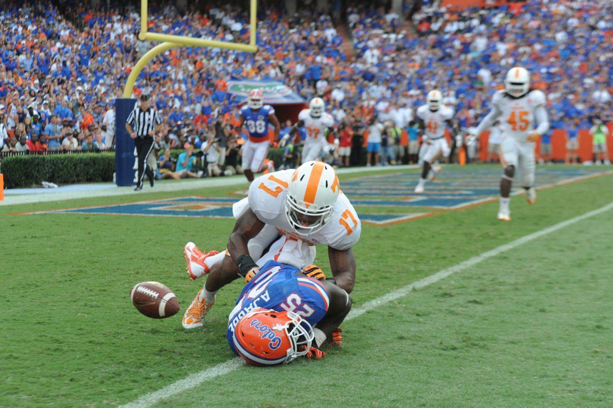 Senior linebacker Brent Brewer breaks up a pass intended for fullback Gideon Ajagbe against the Florida Gators on Sept. 21 in Ben Hill Griffin Stadium. Brewer finished the game with six total tackles and two pass deflections.