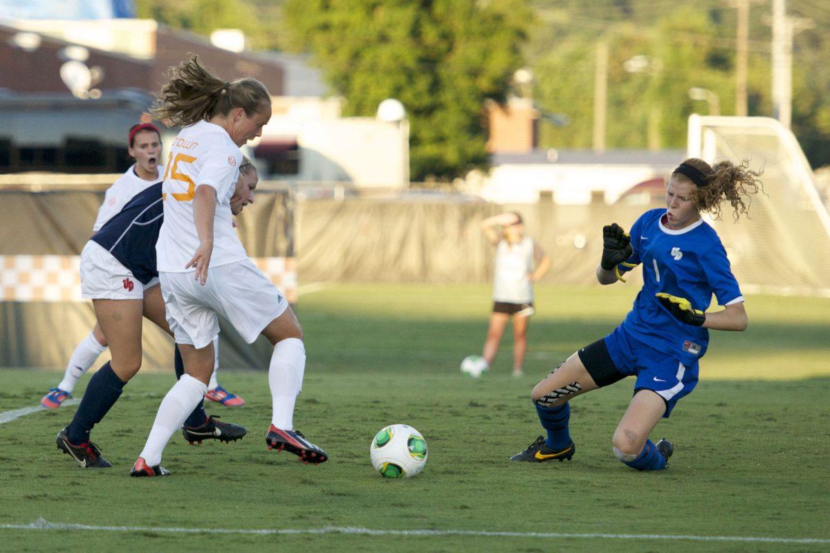 Midfielder Caroline Brown sends a shot on goal against Dayton goalie Elizabeth James at Regal Stadium on Friday, Sept. 6.