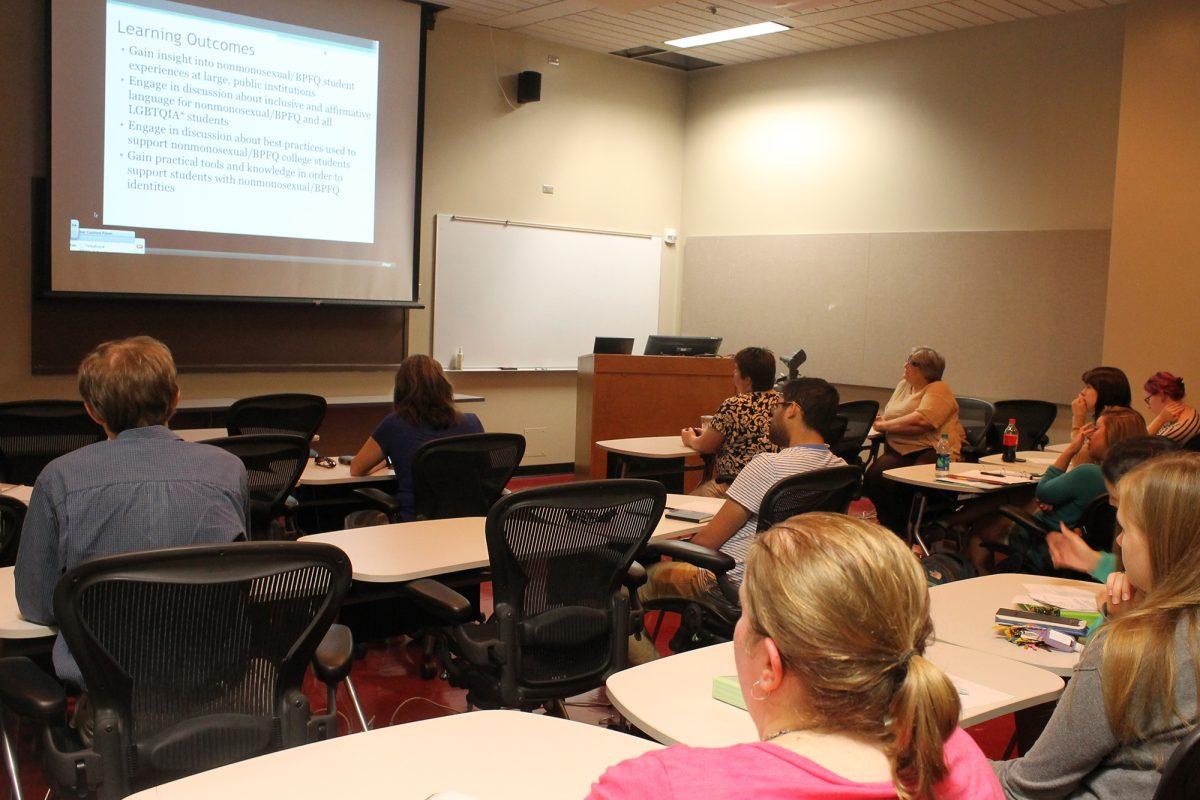 Students watch a presentation during Beyond the Binaries on Sept. 23 that presents the hidden stories surrounding bisexual, pansexual, fluid and queer sexual identities at public four-year universities.