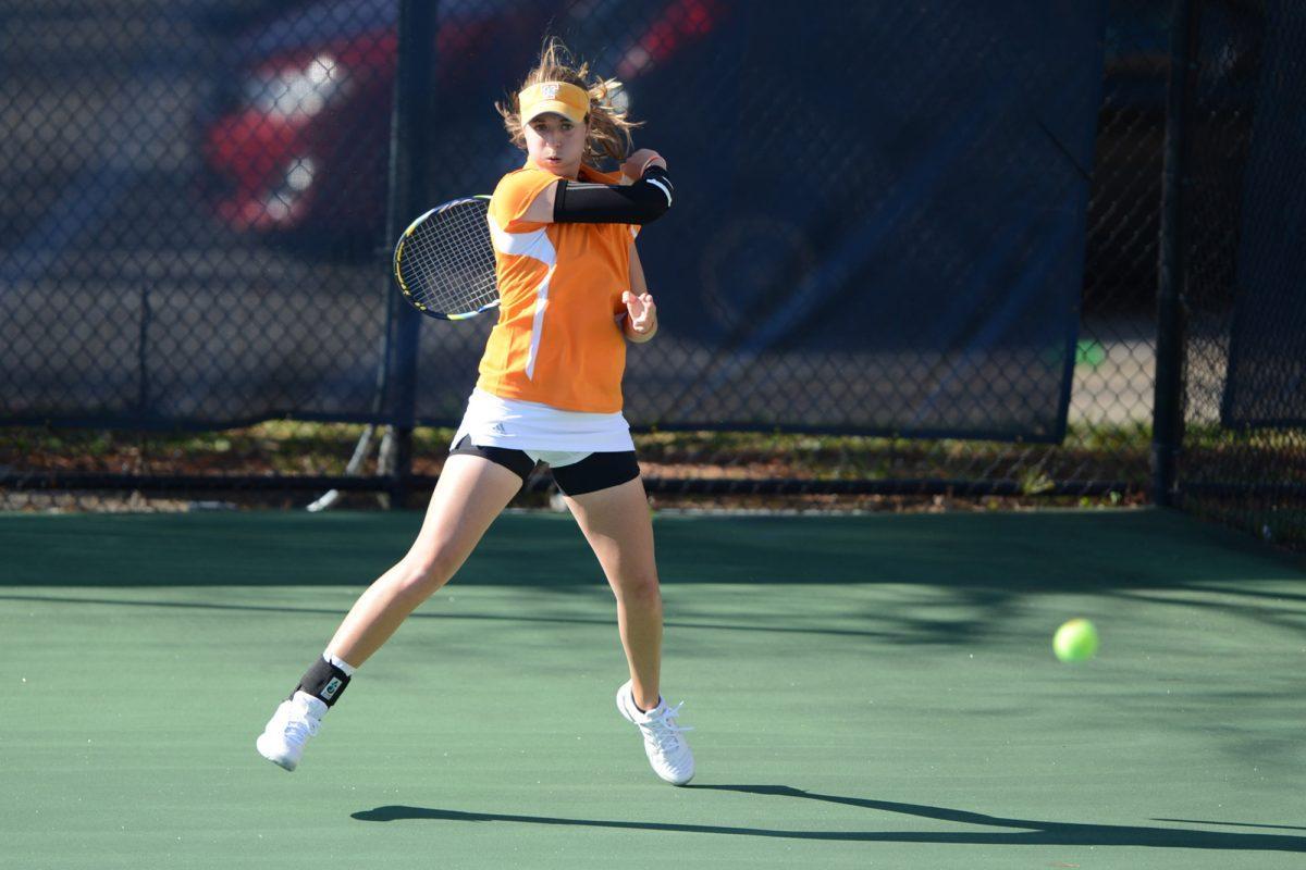 Junior Caitlyn Williams returns a volley with a forehand against the Arkansas Razorbacks at the Dr. Robert L. Barksdale Tennis Stadium on April 5.
