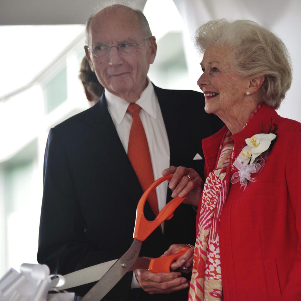 Jim, left, and Natalie Haslam prepare to cut the ribbon at the Natalie L. Haslam Music Center on Sept. 13. Chancellor Jimmy Cheek said the new center had an estimated cost of over $40 million.