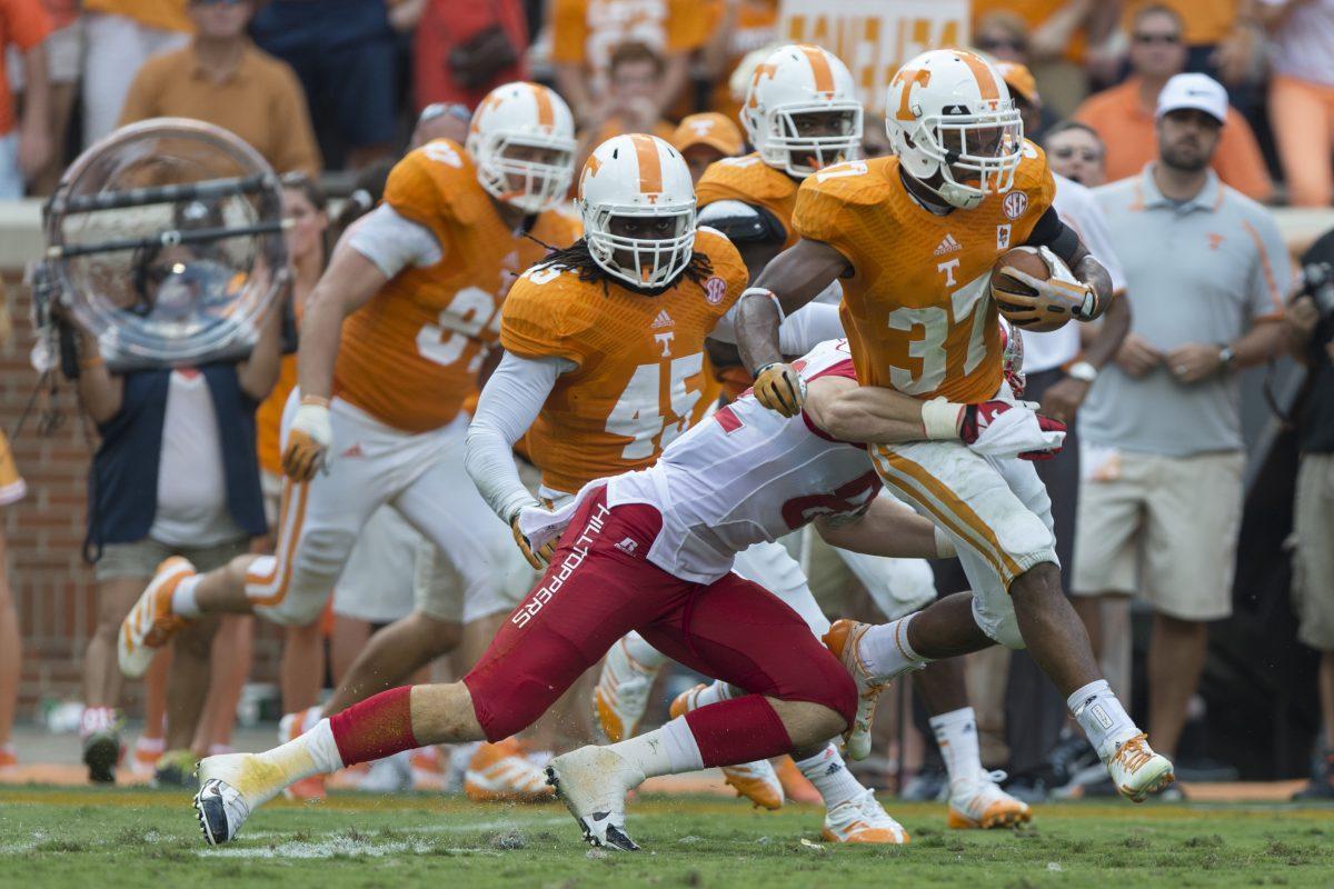 Safety Brian Randolph is tackled after picking off a pass from Western Kentucky quarterback Brandon Doughty in the Vols 52-20 win over the Hilltoppers at Neyland Stadium on Saturday, Sept. 7.