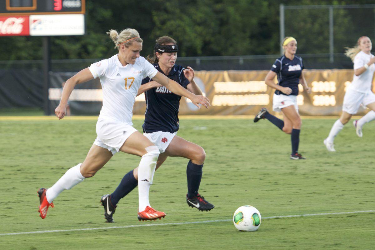 Forward Hannah Wilkinson breezes past a Dayton defender at Regal Stadium on Friday, Sept. 6.