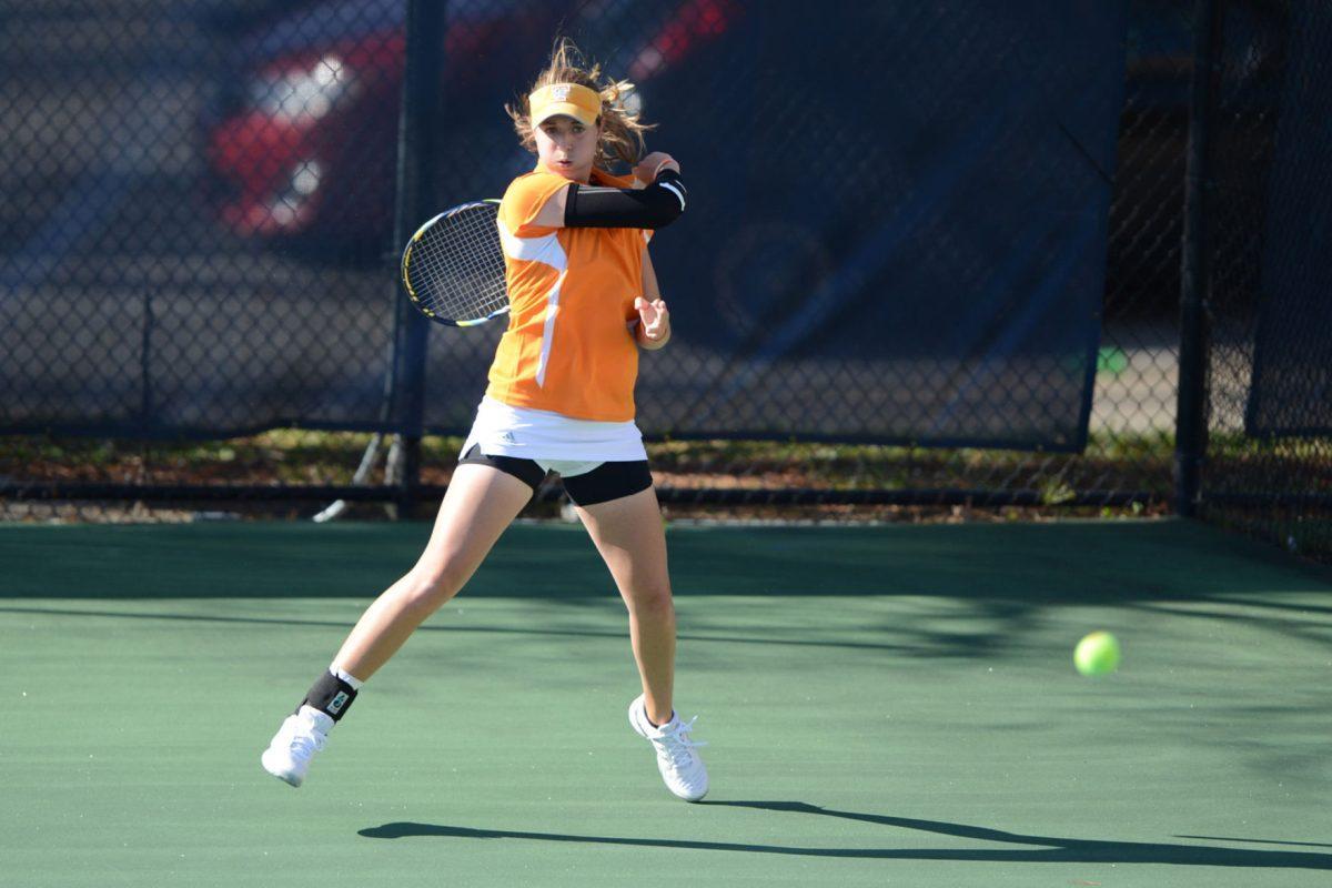 Junior Caitlyn Williams returns a volley with a forehand against the Arkansas Razorbacks at the Dr. Robert L. Barksdale Tennis Stadium on April 5.