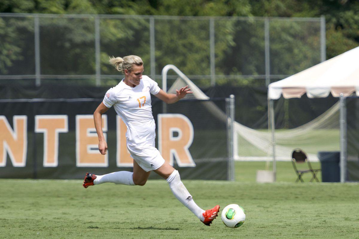 Junior forward Hannah Wilkinson sends a volley into the box during the Lady Vols' matchup against James Madison at Regal Stadium on Sept. 1. Wilkinson scored two goals against the Dukes.