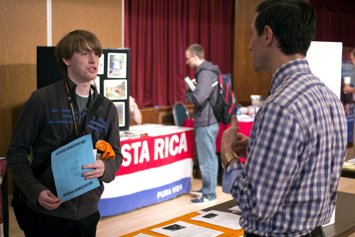 Jason Cowan, left, freshman in business management, speaks with Andrew Seidler from the College of Business Administration about study abroad opportunities. "Study abroad is actually a requirement for my major," Cowan said, "but that's not a big deal. It's an opportunity."