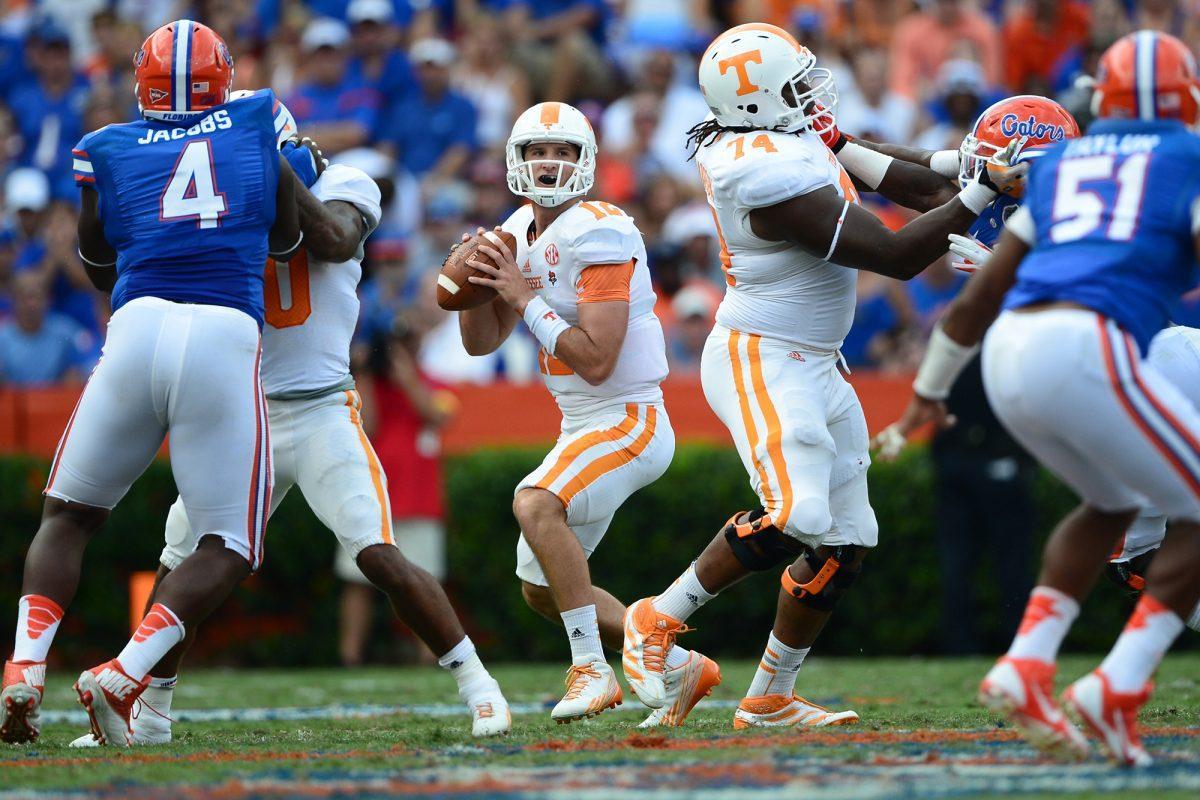 Freshman quarterback Nathan Peterman looks downfield for a receiver in his first collegiate start against Florida at Ben Hill Griffin Stadium on Saturday, Sept. 21. After passing for only 5 yards on 11 attempts in the first half, Peterman was pulled prior to halftime in favor of Justin Worley.