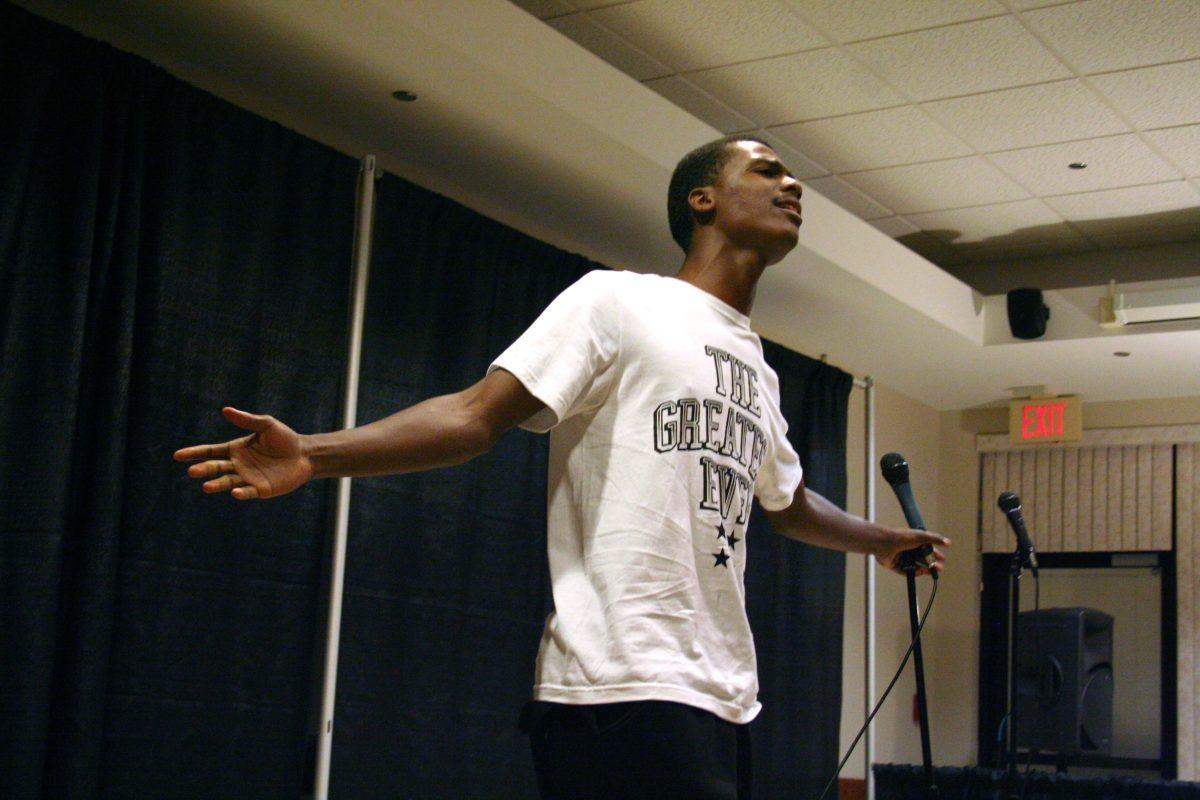 Freshman Maurice Ash sings "I Believe I Can Fly" during his time at the open mic in the Mahogany Soul Cafe in the Black Cultural Center on Sept. 24.