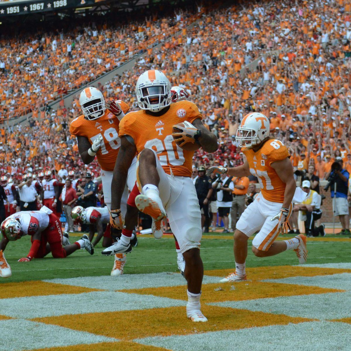 Senior running back Rajion Neal celebrates one of three touchdowns against Western Kentucky on Sept. 7 in Neyland Stadium. With a potential change at quarterback this week at "The Swamp," Neal could be asked to shoulder the load offensively for the Vols.