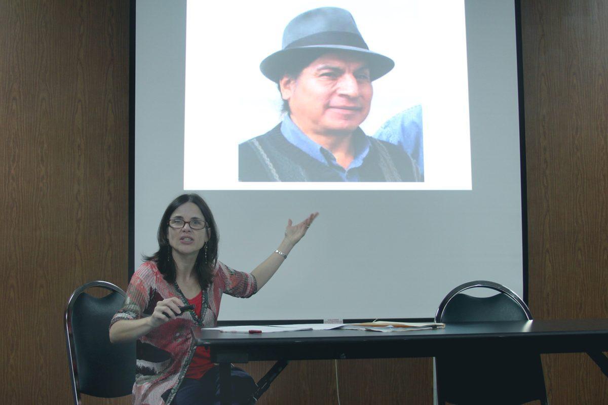 Carmen Martinez Novo, Ph.D, an associate professor in the Department of Anthropology at the University of Kentucky, gestures to an Ecuadorian man during her lecture on Sept. 23 in the UC.