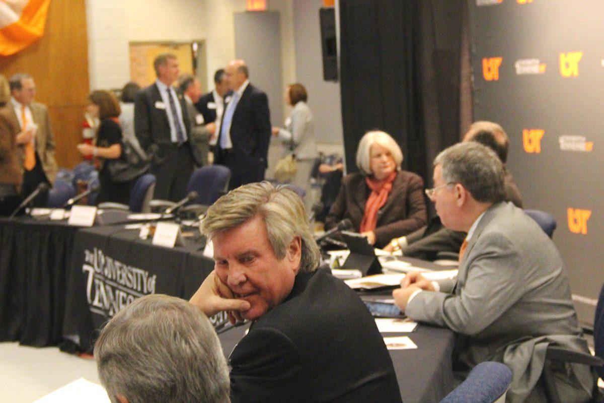 Karl A. Schledwitz, middle, waits for the Board of Trustees meeting to begin on Oct. 18. Schledwitz presented an official recognition by the board to former member Doug Horne for his years of service to UT.
