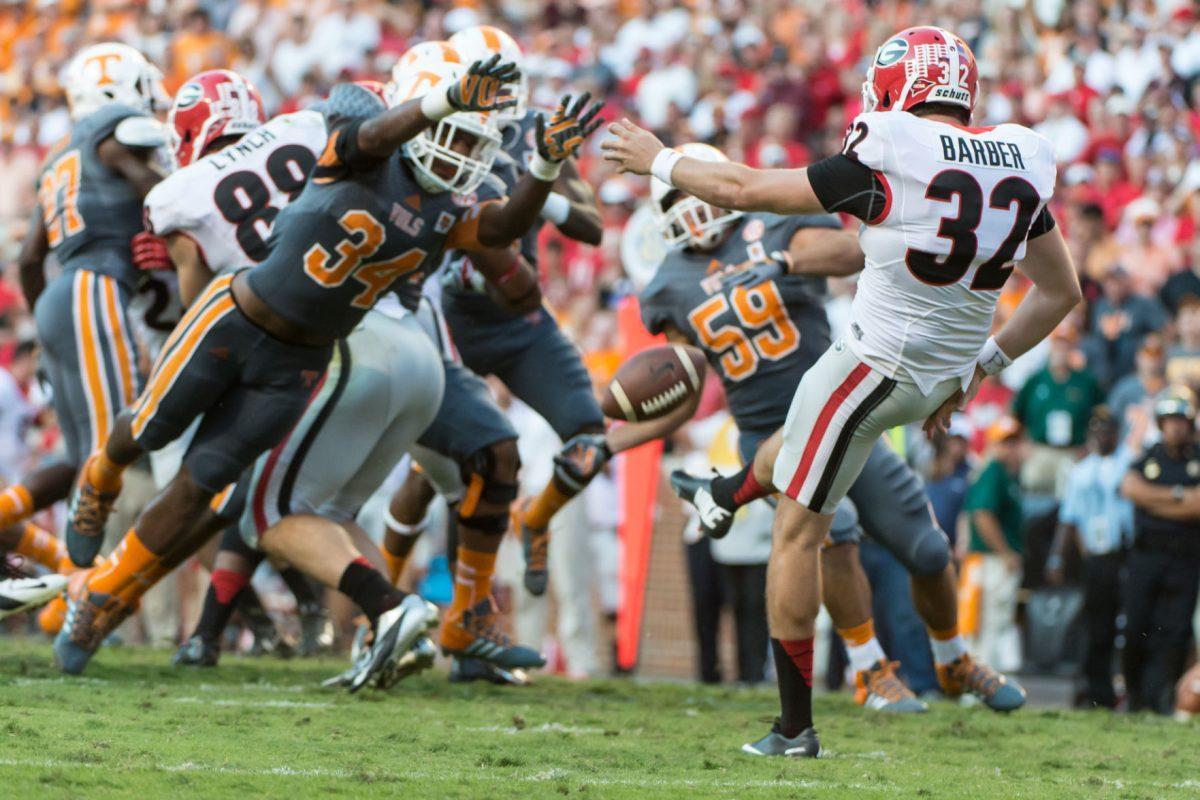 Tennessee freshman linebacker Jalen Reeves-Maybin fully extends and blocks a punt from Georgia punter Colin Barber at Neyland Stadium on Oct. 5. Reeves-Maybin has recorded six tackles on special teams this season.